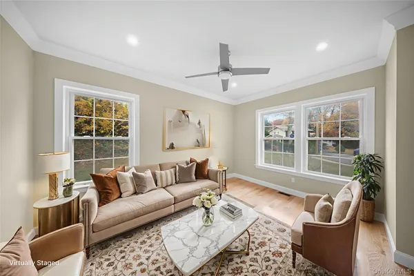 a living room with furniture and a window