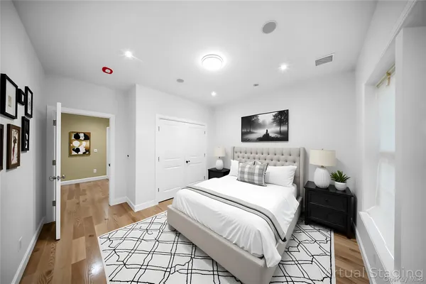 a bedroom with a bed and a view of bathroom