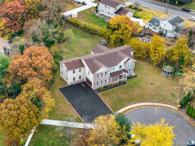an aerial view of a house with a ocean view