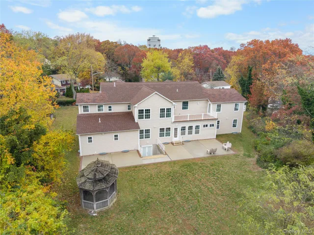 an aerial view of a house with a big yard