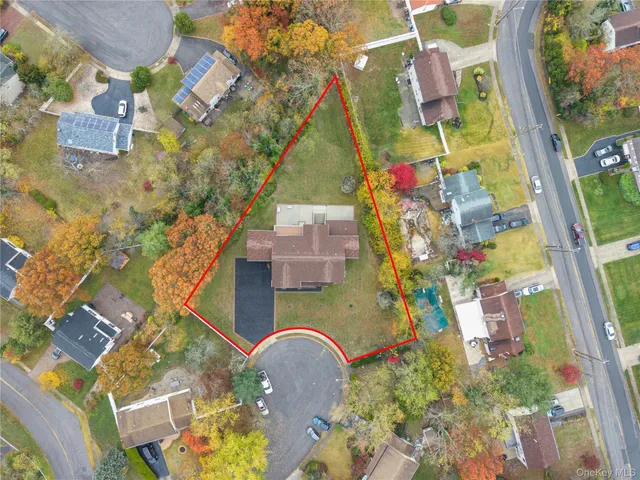 an aerial view of residential house with outdoor space and swimming pool