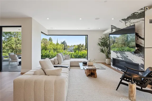 a balcony with furniture and wooden floor