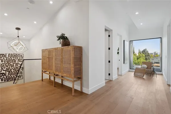 a balcony with table and chairs