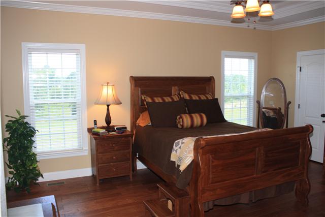146 Slaughter Pen Road Ardmore, TN 38449 - Photo 11 of 18 Master Bedroom - More hand scraped hardwood floods, trey ceiling with cove lighting and two closets.