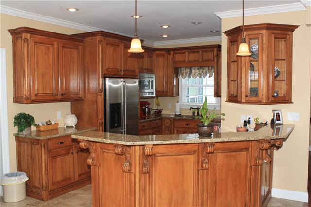 146 Slaughter Pen Road Ardmore, TN 38449 - Photo 6 of 18 Kitchen - Tile flooring, recessed and pendant lighting, granite counters, stainless steel appliances, custom cabinetry and raised bar make this space a cook's delight.
