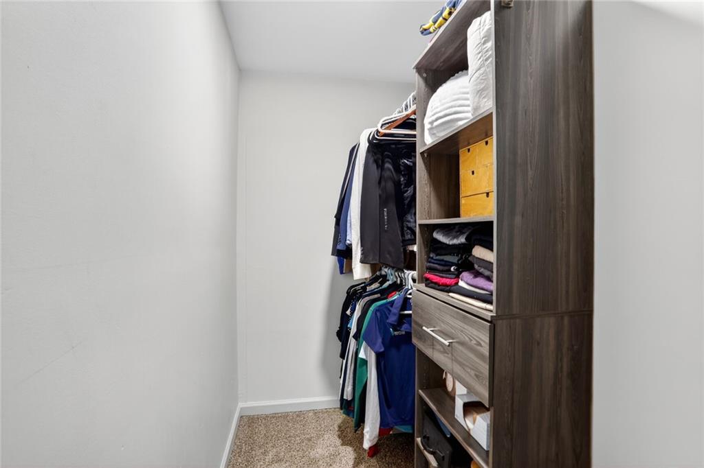 3306 Northcrest Road, Unit A Atlanta, GA 30340 - Photo 15 of 22 a view of walk in closet with clothes