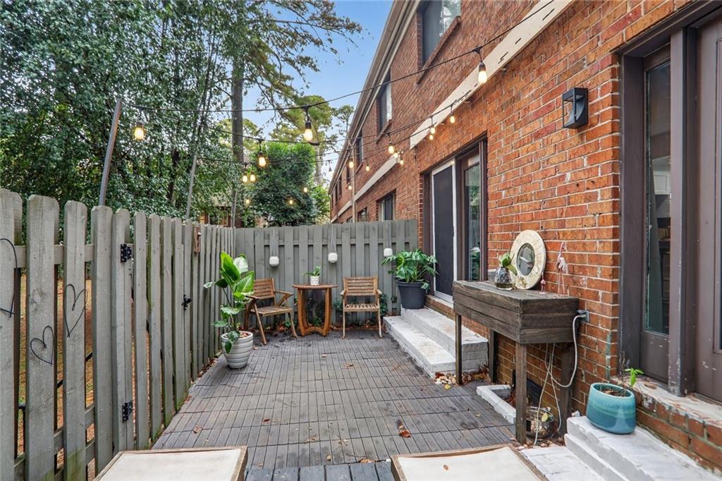 3306 Northcrest Road, Unit A Atlanta, GA 30340 - Photo 19 of 22 a view of a dinning tables and chairs in the patio in back of the house
