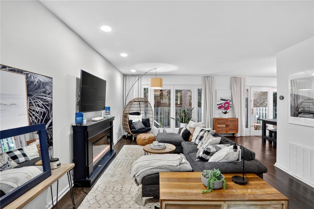 3306 Northcrest Road, Unit A Atlanta, GA 30340 - Photo 3 of 22 a living room with fireplace furniture and a flat screen tv