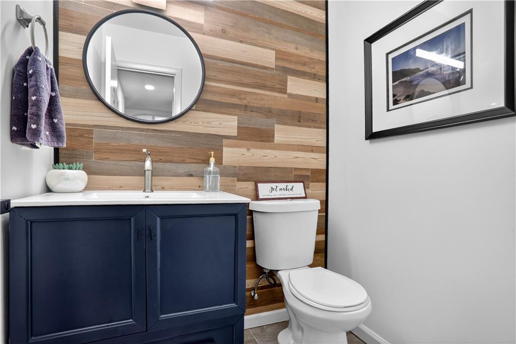 3306 Northcrest Road, Unit A Atlanta, GA 30340 - Photo 10 of 22 a bathroom with a toilet a sink and a mirror