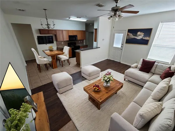 a living room with furniture and a flat screen tv