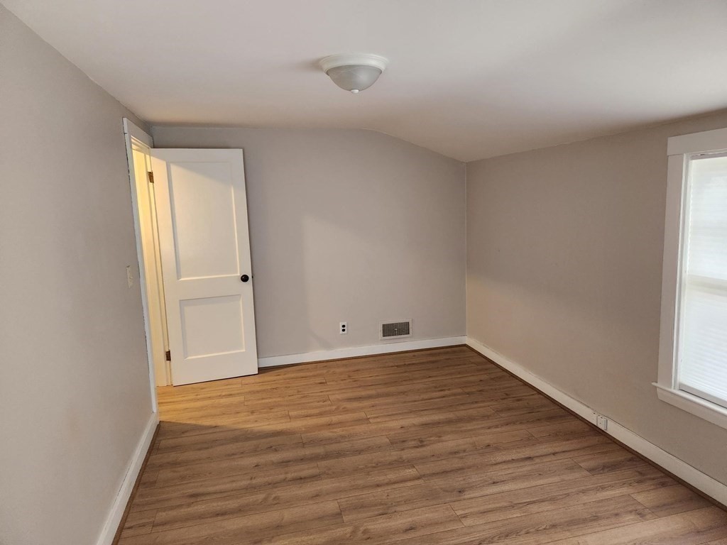 5 Ray Street, Unit 5 Hopkinton, MA 01748 - Photo 11 of 15 wooden floor in an empty room