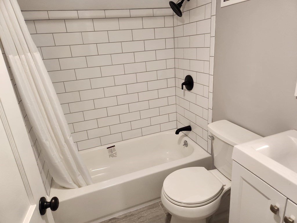 5 Ray Street, Unit 5 Hopkinton, MA 01748 - Photo 15 of 15 a bathroom with a toilet and a shower
