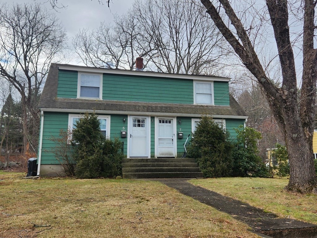 5 Ray Street, Unit 5 Hopkinton, MA 01748 - Photo 2 of 15 a front view of a house with garden