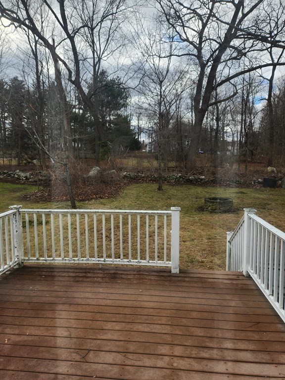 5 Ray Street, Unit 5 Hopkinton, MA 01748 - Photo 3 of 15 a balcony with wooden floor and lake view