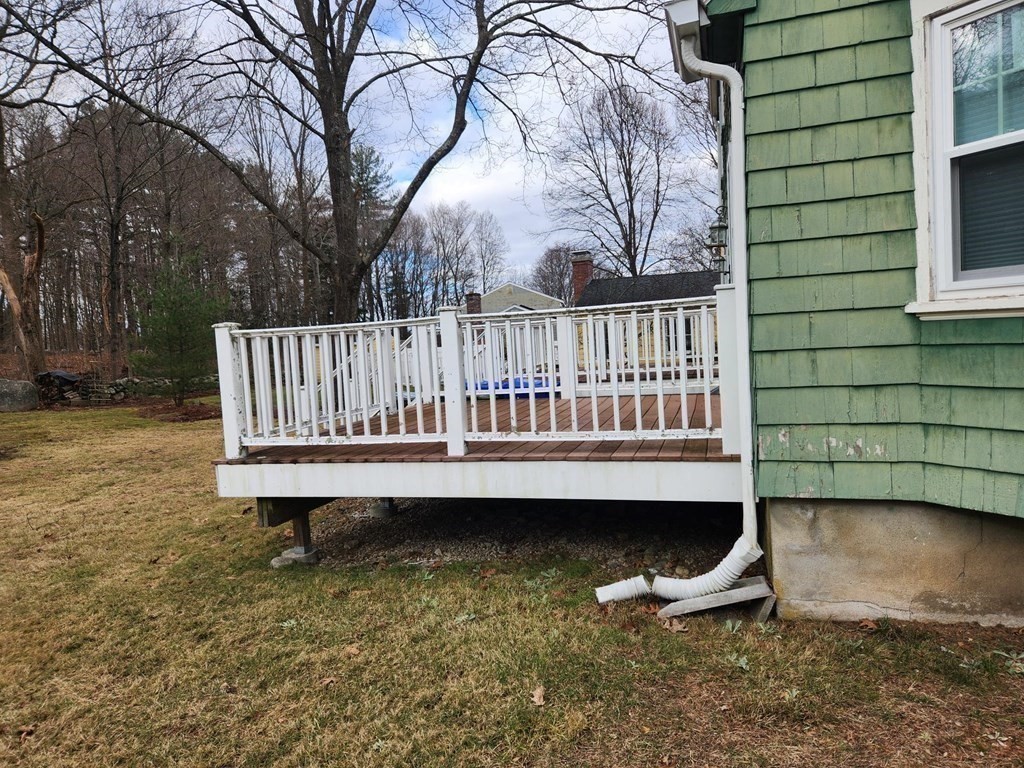 5 Ray Street, Unit 5 Hopkinton, MA 01748 - Photo 4 of 15 a view of a roof deck with wooden fence and a bench