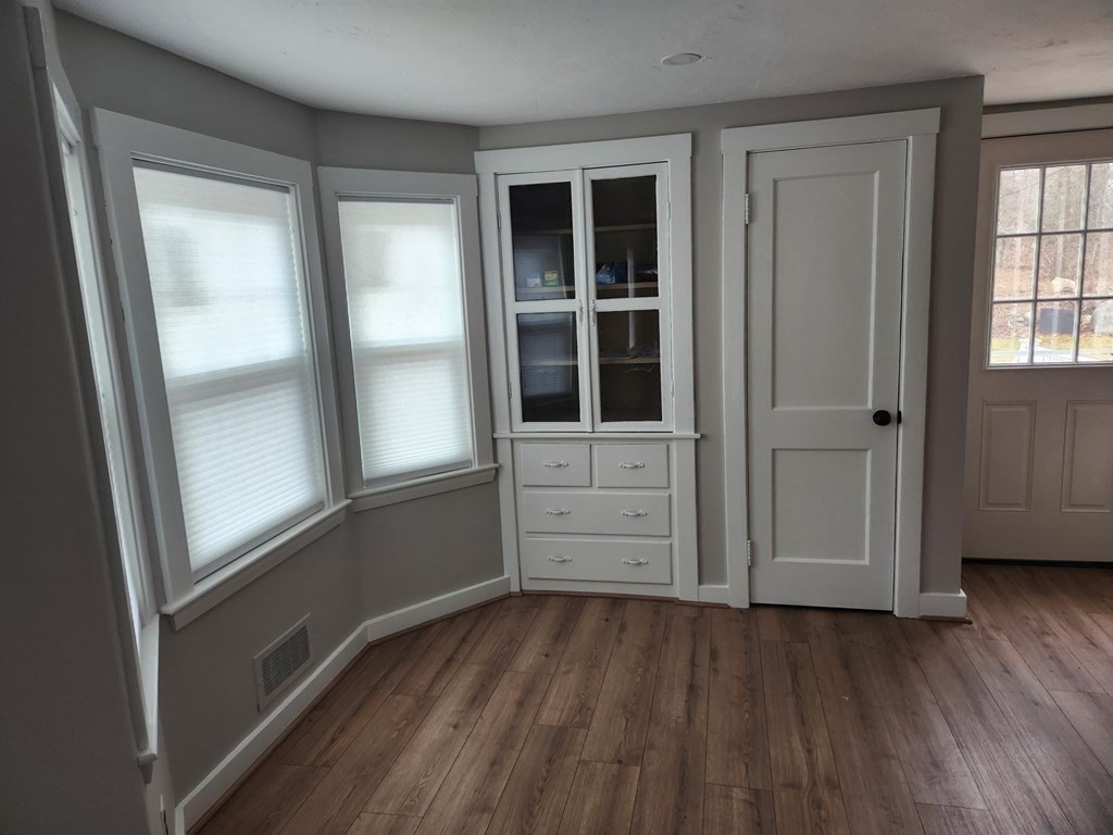 5 Ray Street, Unit 5 Hopkinton, MA 01748 - Photo 8 of 15 wooden floor and windows in a room