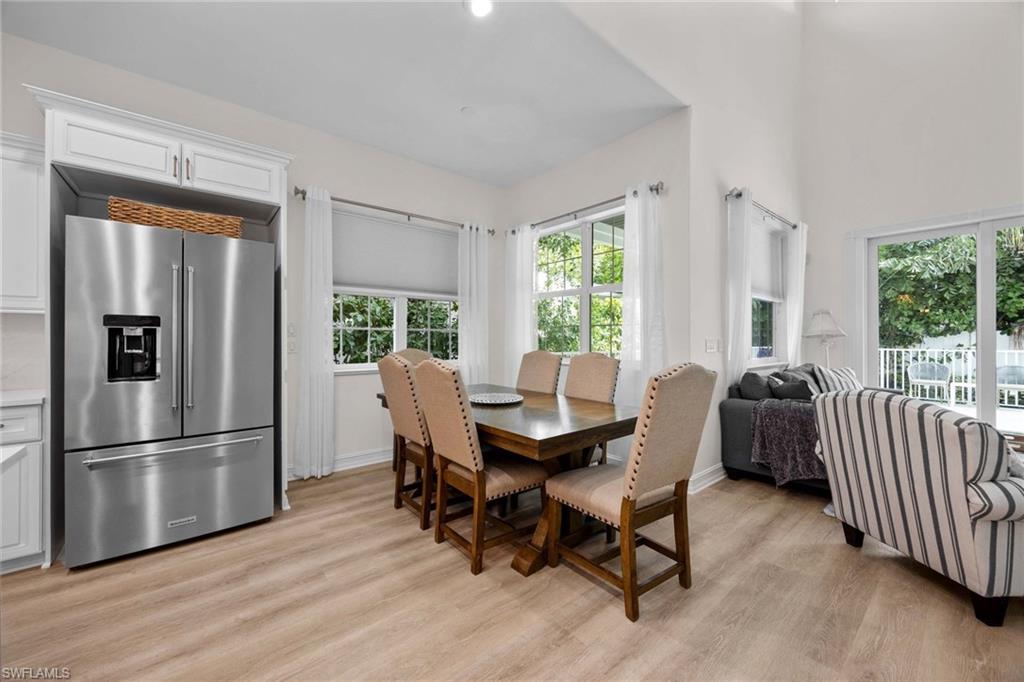 160 3rd Street North Naples, FL 34102 - Photo 16 of 48 a view of a dining room with furniture window and outside view