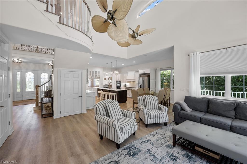 160 3rd Street North Naples, FL 34102 - Photo 23 of 48 a living room with furniture and a large window