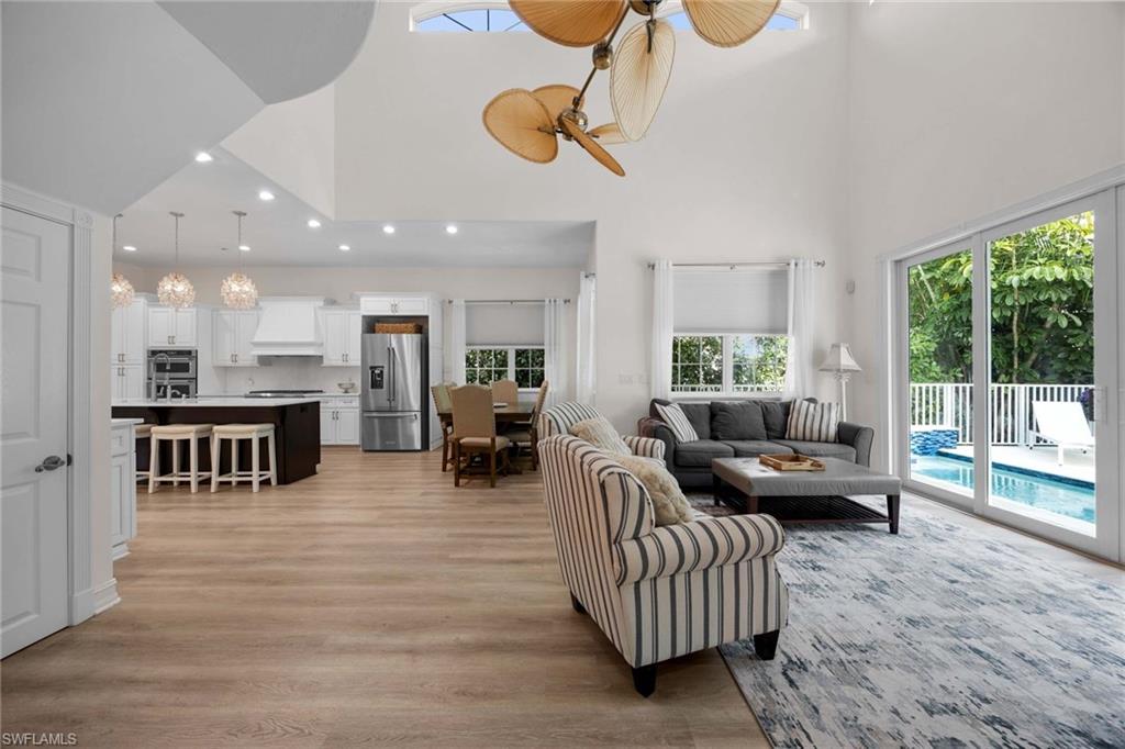 160 3rd Street North Naples, FL 34102 - Photo 24 of 48 a living room with furniture and a table
