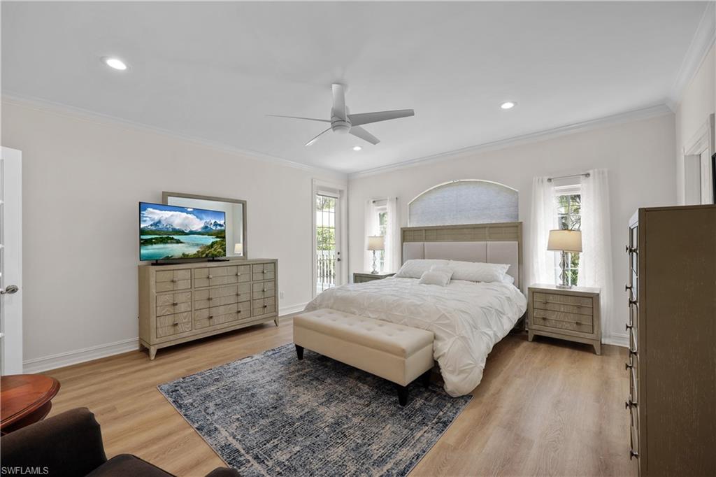 160 3rd Street North Naples, FL 34102 - Photo 26 of 48 a bedroom with a bed and a flat screen tv