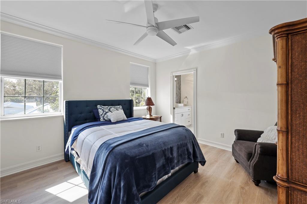 160 3rd Street North Naples, FL 34102 - Photo 32 of 48 a bedroom with bed and a window