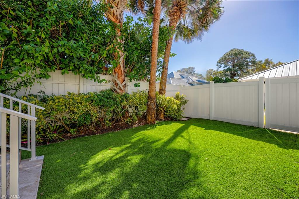 160 3rd Street North Naples, FL 34102 - Photo 37 of 48 a view of a backyard with a garden