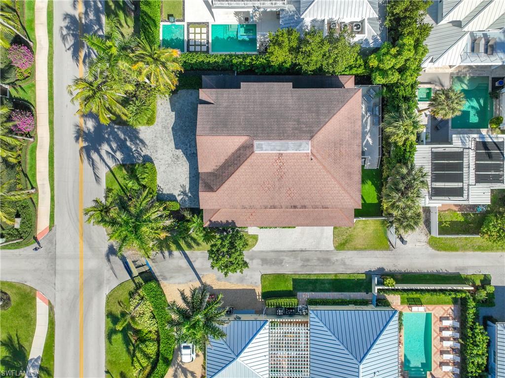160 3rd Street North Naples, FL 34102 - Photo 39 of 48 an aerial view of a house with swimming pool and garden