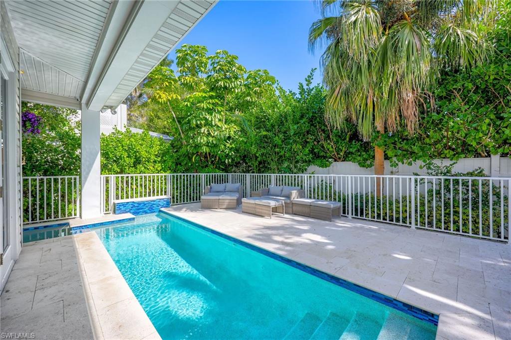 160 3rd Street North Naples, FL 34102 - Photo 45 of 48 a view of a backyard with a small pool
