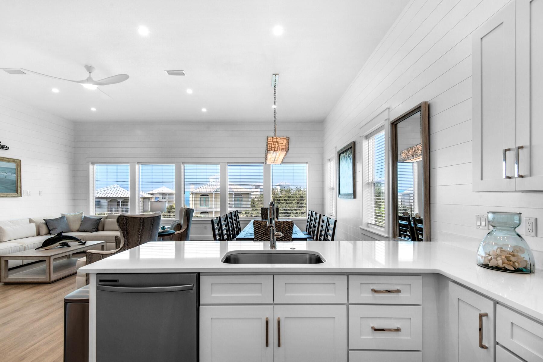 78 Cote D Azur Drive Santa Rosa Beach, FL 32459 - Photo 15 of 80 a kitchen with counter top space cabinets and stainless steel appliances