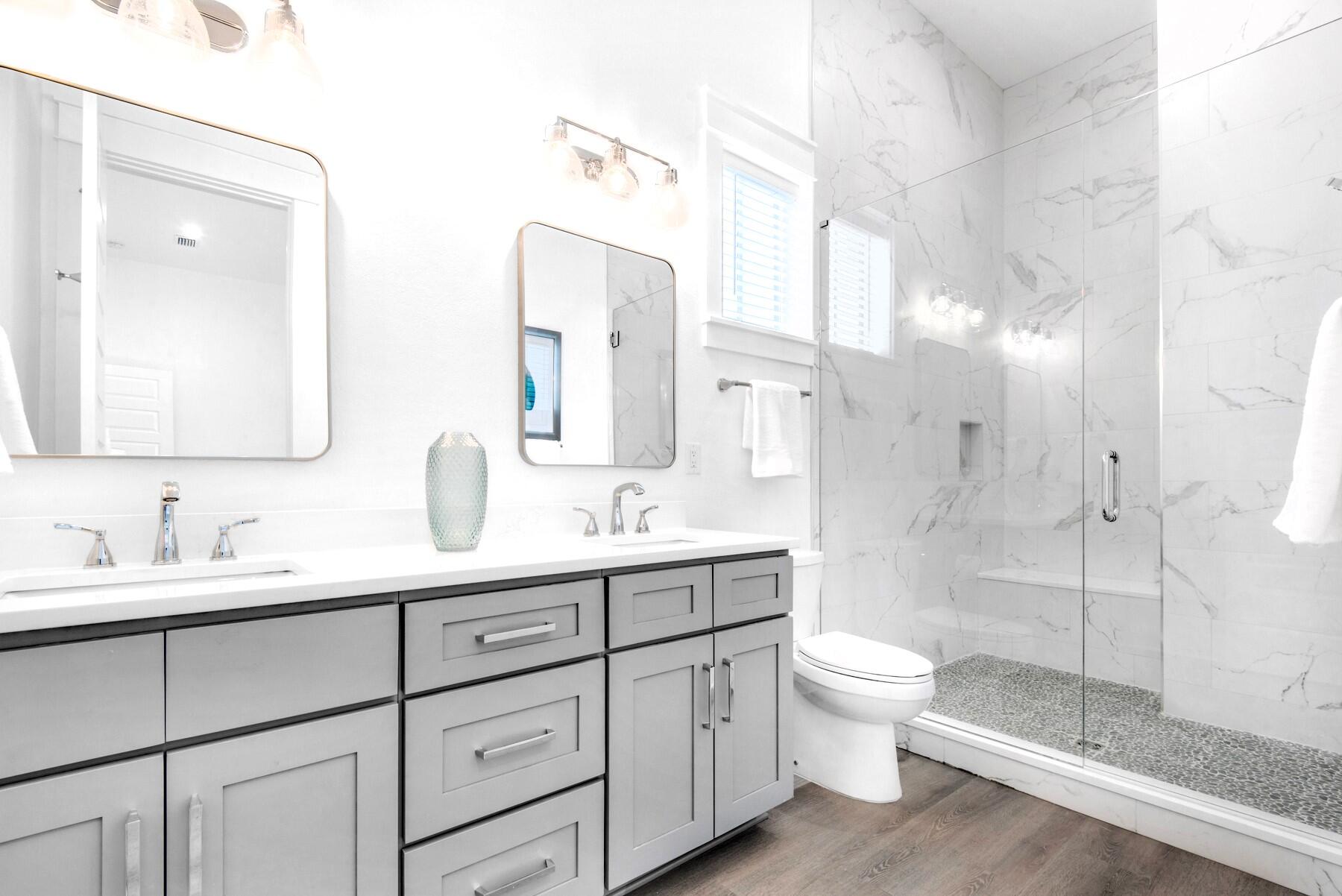 78 Cote D Azur Drive Santa Rosa Beach, FL 32459 - Photo 19 of 80 a bathroom with a double vanity sink toilet mirror and shower