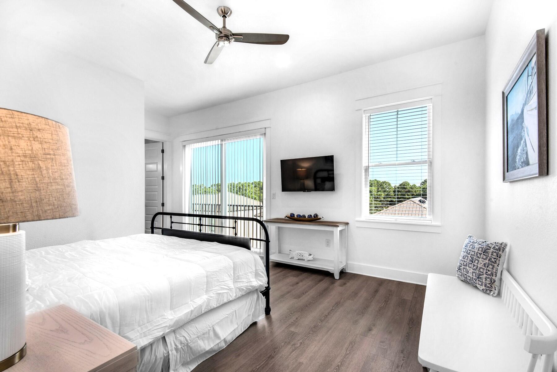 78 Cote D Azur Drive Santa Rosa Beach, FL 32459 - Photo 23 of 80 a bedroom with a bed and a flat screen tv