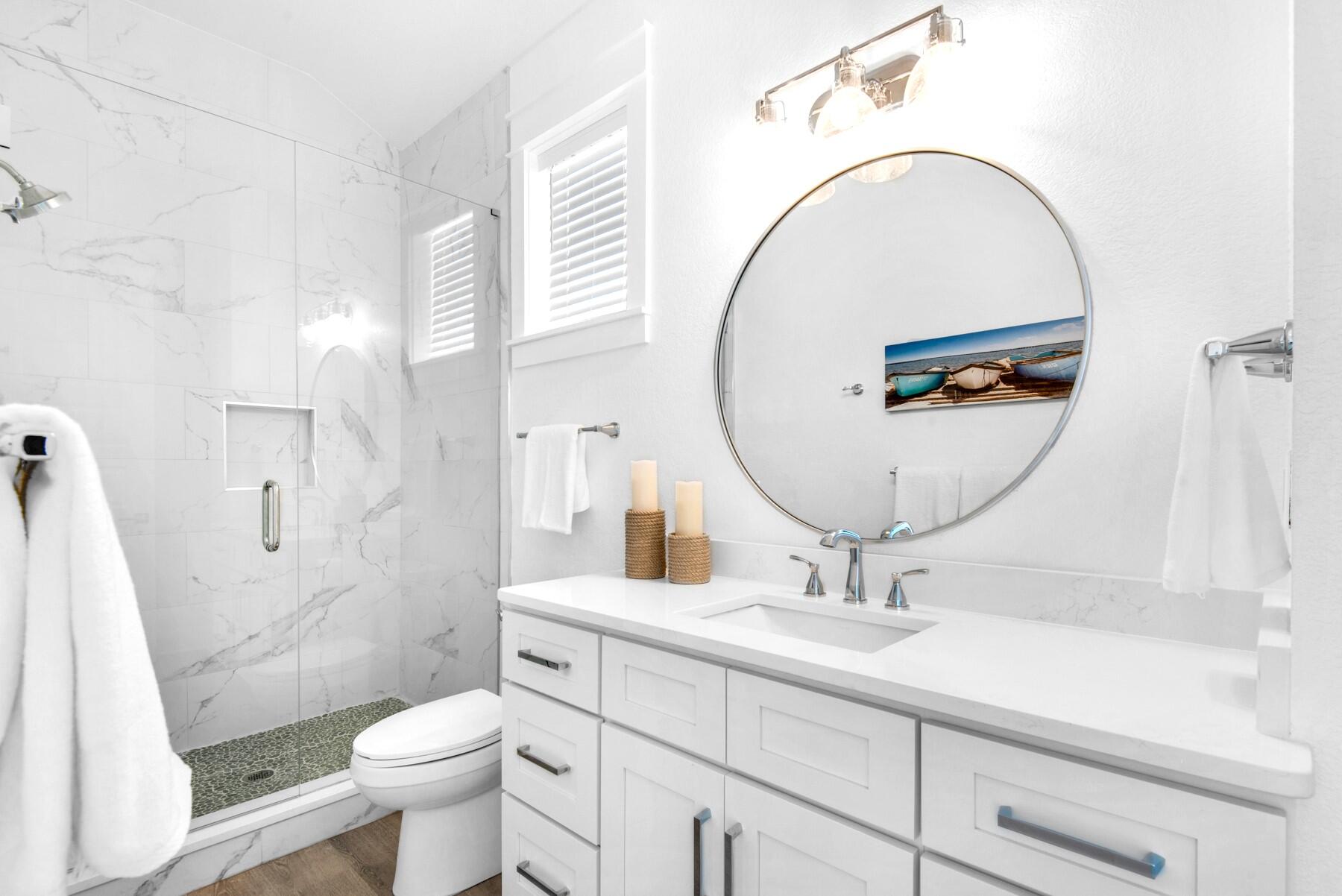 78 Cote D Azur Drive Santa Rosa Beach, FL 32459 - Photo 24 of 80 a bathroom with a sink a toilet and a mirror