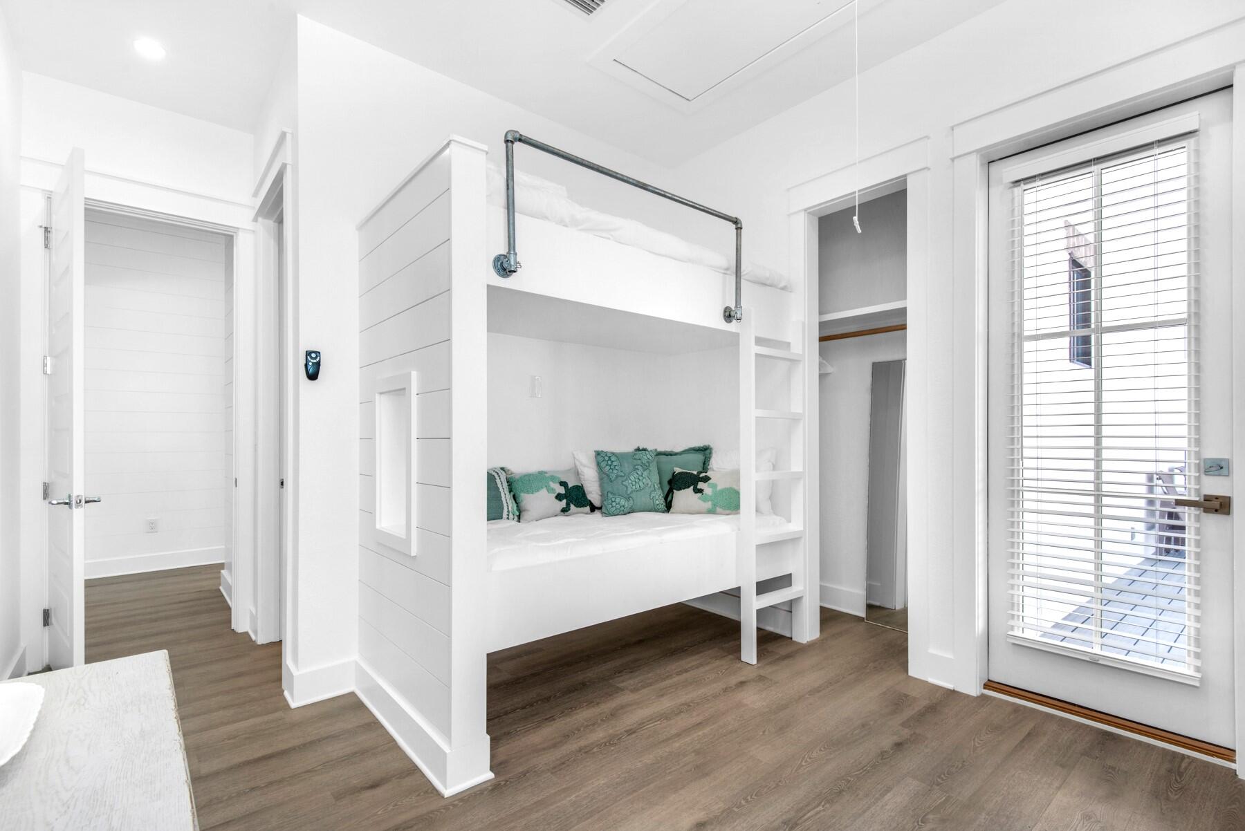 78 Cote D Azur Drive Santa Rosa Beach, FL 32459 - Photo 25 of 80 a view of a room with wooden floor and windows
