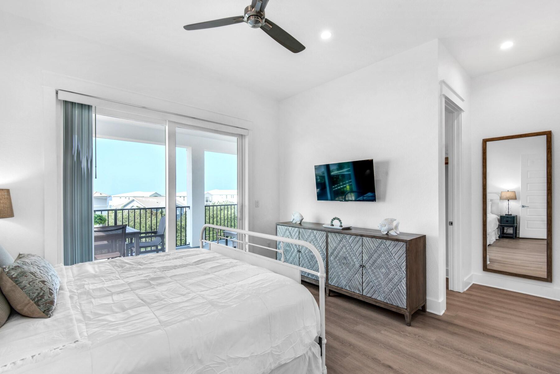 78 Cote D Azur Drive Santa Rosa Beach, FL 32459 - Photo 29 of 80 a bedroom with a bed and a flat screen tv