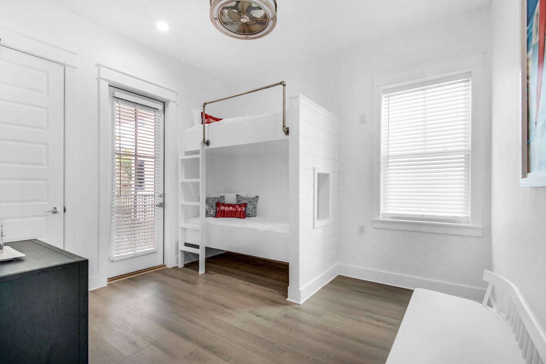 78 Cote D Azur Drive Santa Rosa Beach, FL 32459 - Photo 35 of 80 a view of an empty room with a window and wooden floor