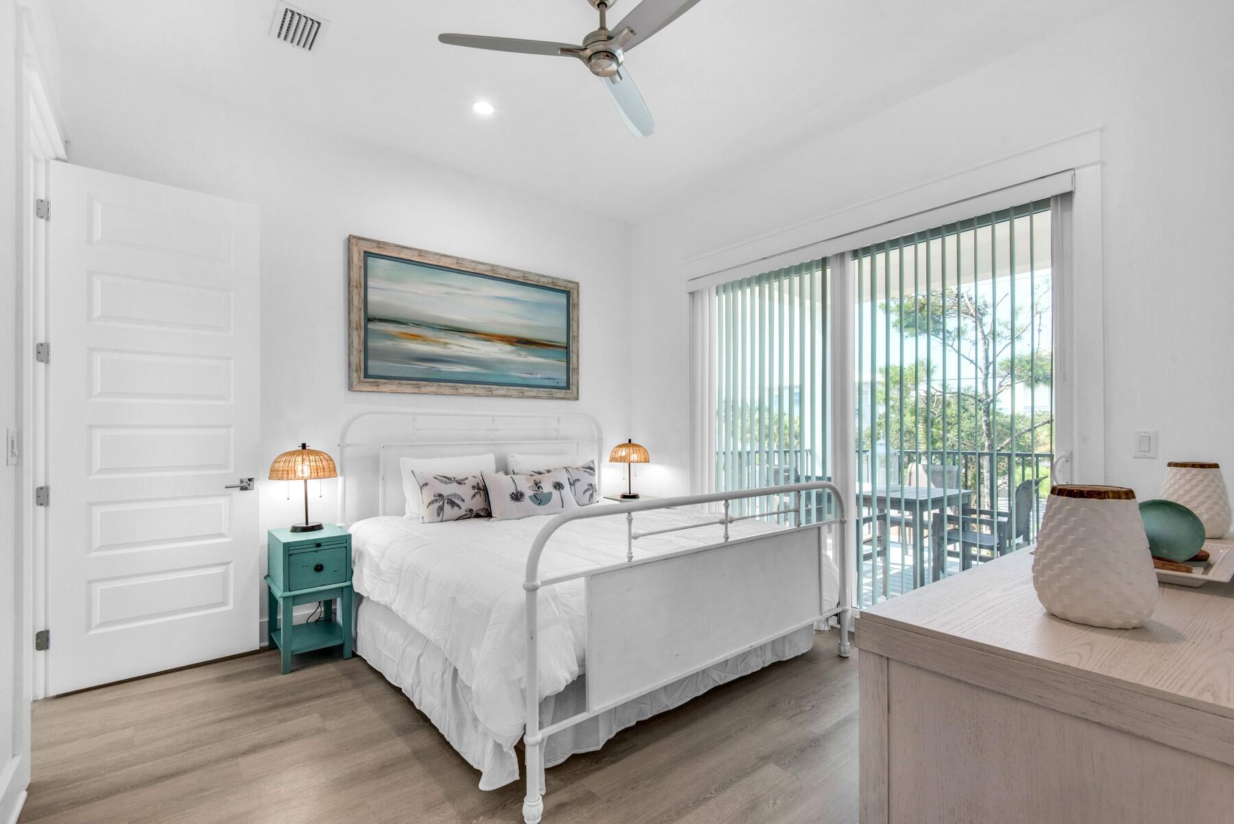 78 Cote D Azur Drive Santa Rosa Beach, FL 32459 - Photo 38 of 80 a bedroom with a bed and wooden floor