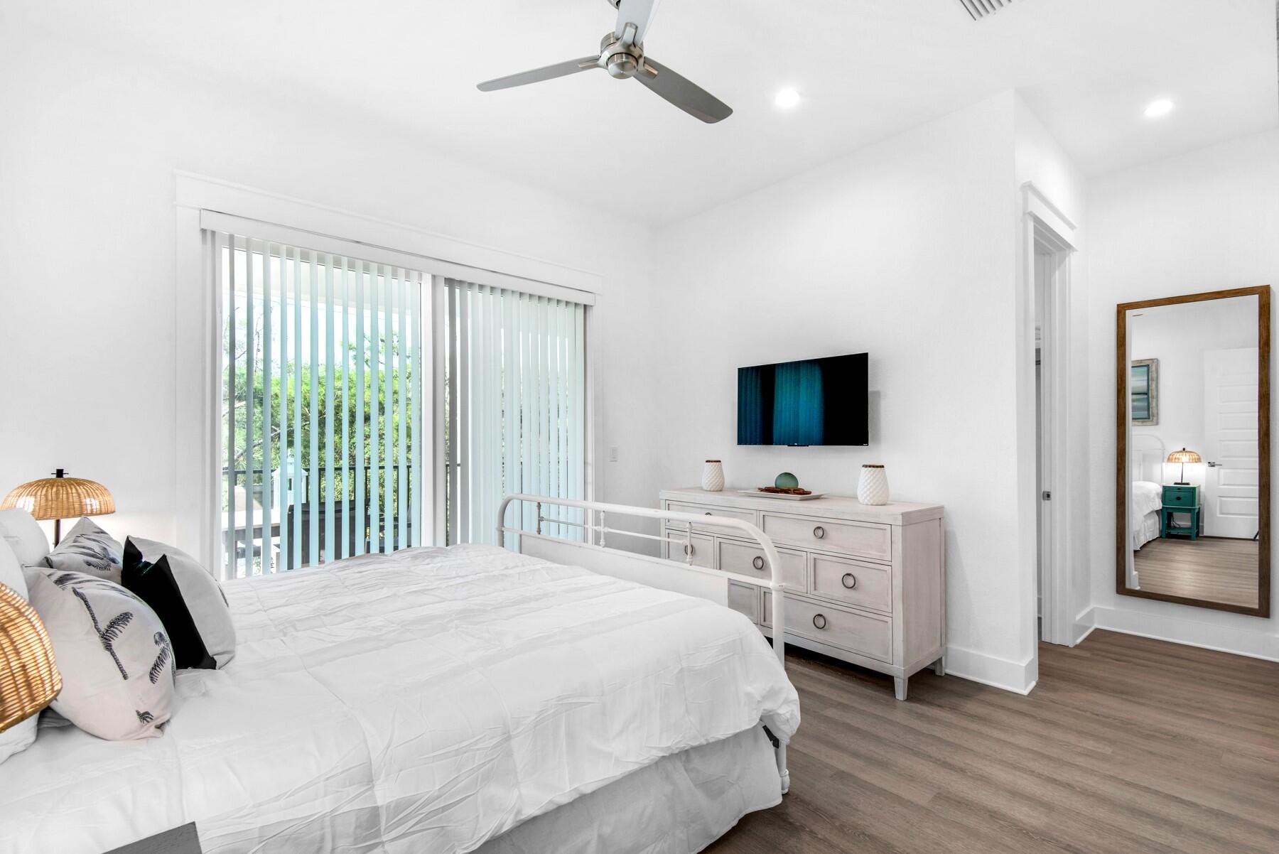 78 Cote D Azur Drive Santa Rosa Beach, FL 32459 - Photo 39 of 80 a bedroom with a bed and a flat tv screen on dresser