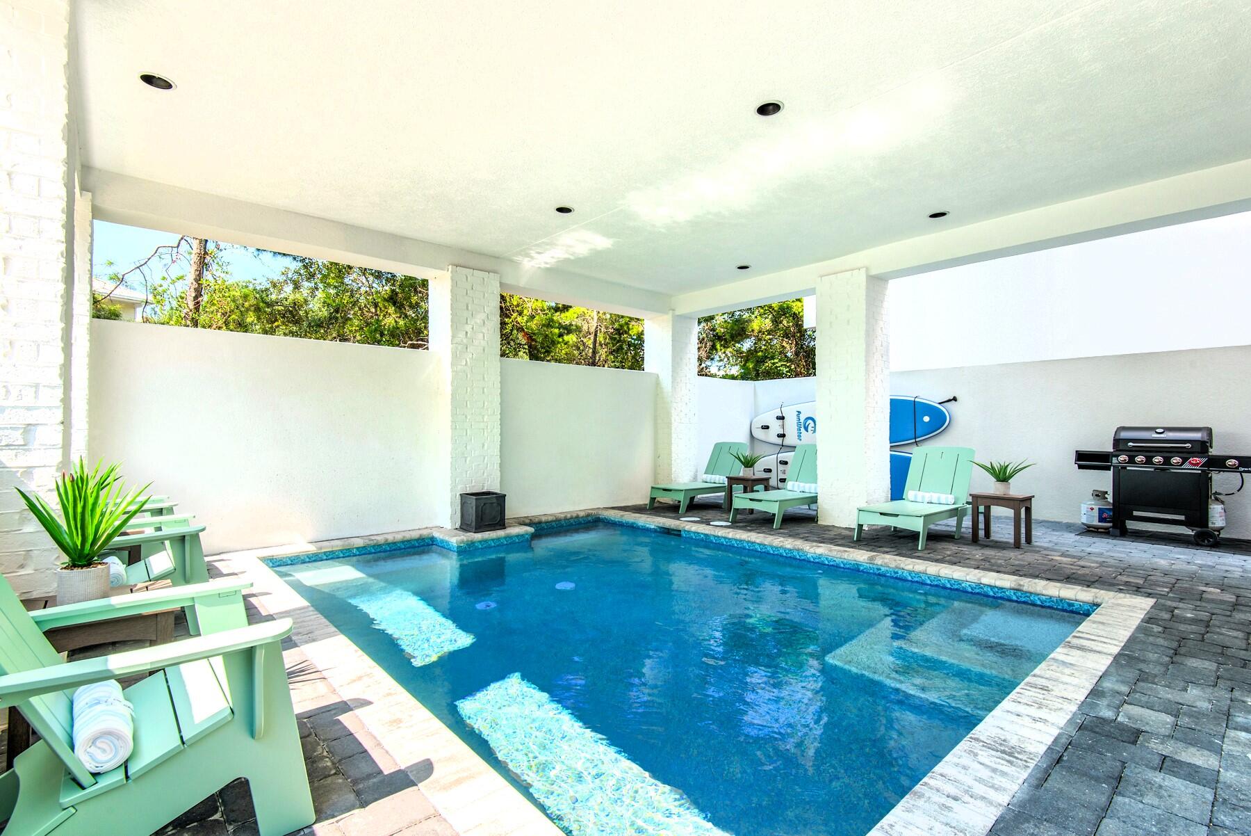 78 Cote D Azur Drive Santa Rosa Beach, FL 32459 - Photo 7 of 80 a living room with furniture floor to ceiling window and wooden floor