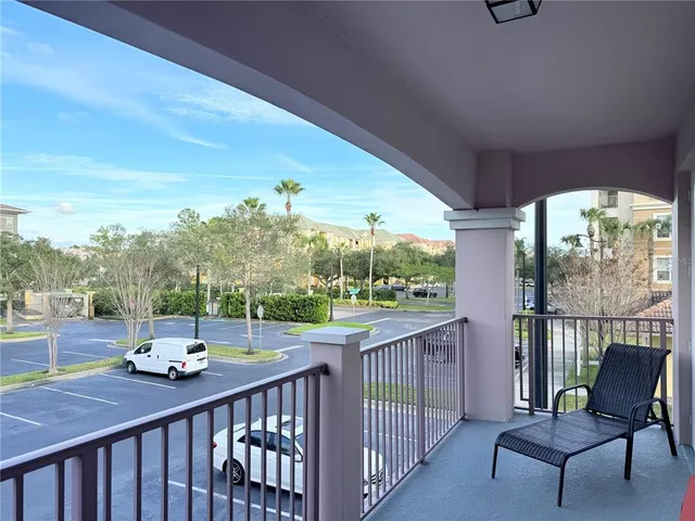 a view of a swimming pool with an outdoor seating