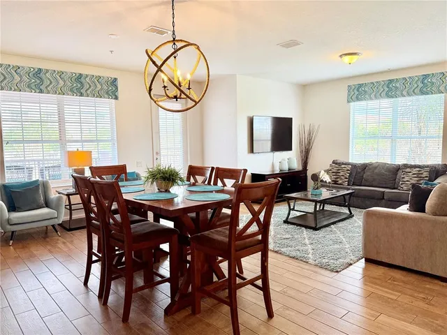 a kitchen with stainless steel appliances granite countertop a sink refrigerator and cabinets