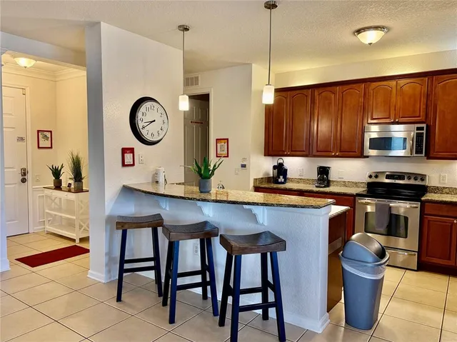 a bedroom with a bed and a chair