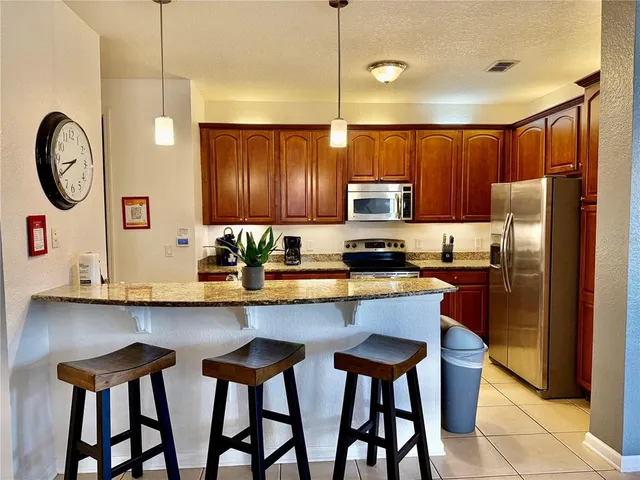 a bathroom with a sink vanity and a mirror