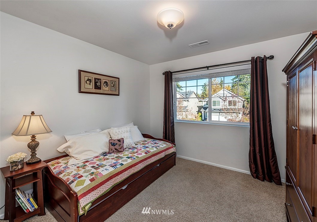 1314 124th Place Southeast Everett, WA 98208 - Photo 15 of 23 a living room with a bed and a window