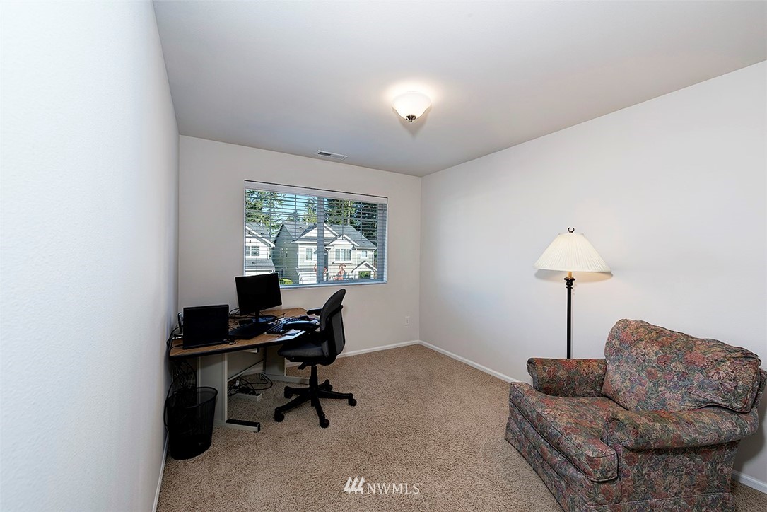 1314 124th Place Southeast Everett, WA 98208 - Photo 17 of 23 a living room with furniture and a chandelier