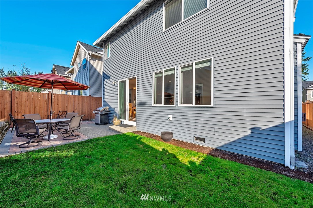 1314 124th Place Southeast Everett, WA 98208 - Photo 18 of 23 a view of a chair and table in backyard of the house