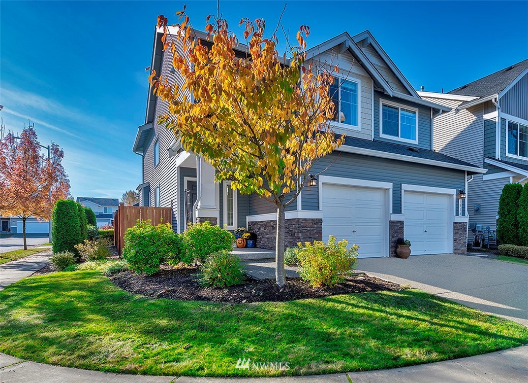 1314 124th Place Southeast Everett, WA 98208 - Photo 19 of 23 a front view of a house with garden