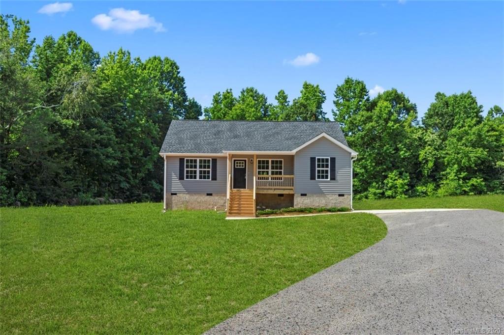 2979 Greenleaf Road, Unit 5 Clover, SC 29710 - Photo 2 of 46 a front view of a house with a yard and trees
