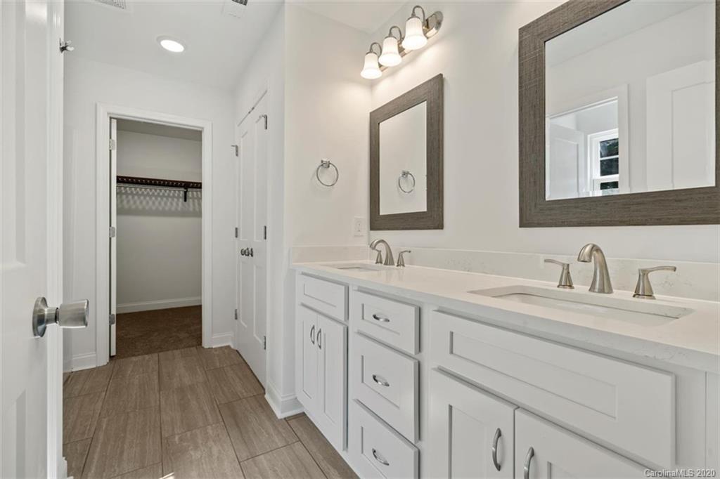 2979 Greenleaf Road, Unit 5 Clover, SC 29710 - Photo 22 of 46 a spacious bathroom with a double vanity sink double and mirror