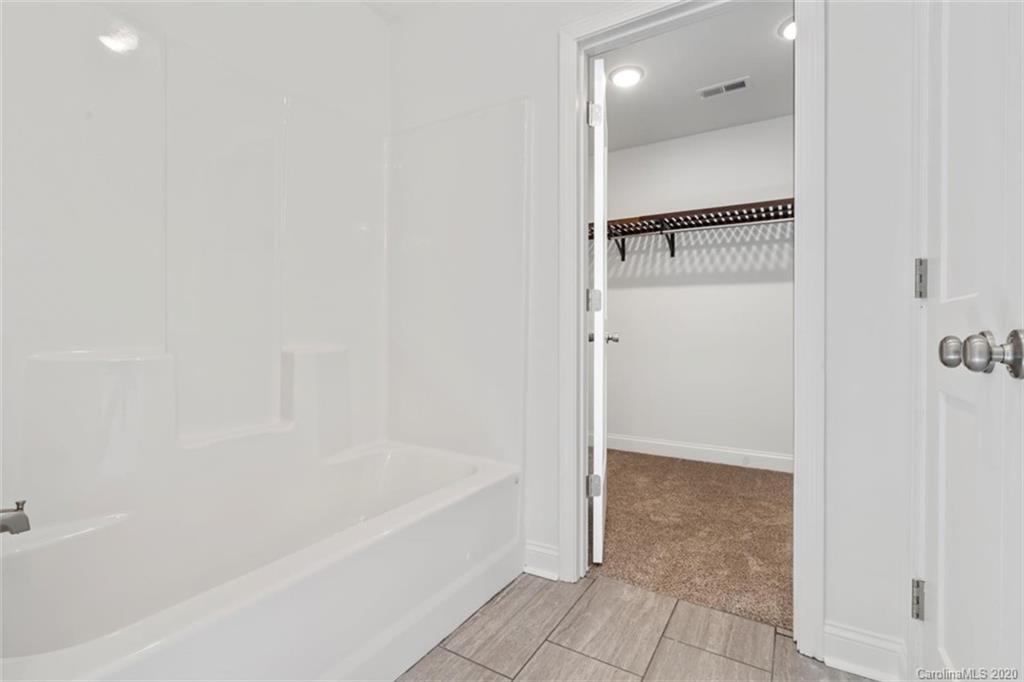 2979 Greenleaf Road, Unit 5 Clover, SC 29710 - Photo 26 of 46 a bathroom with a bathtub and a shower