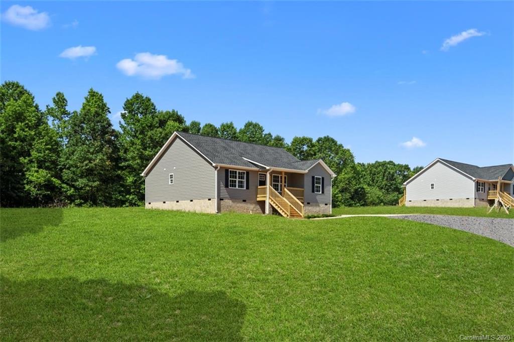 2979 Greenleaf Road, Unit 5 Clover, SC 29710 - Photo 4 of 46 a view of a house with a big yard and large tree